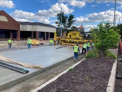 Workers pouring cement